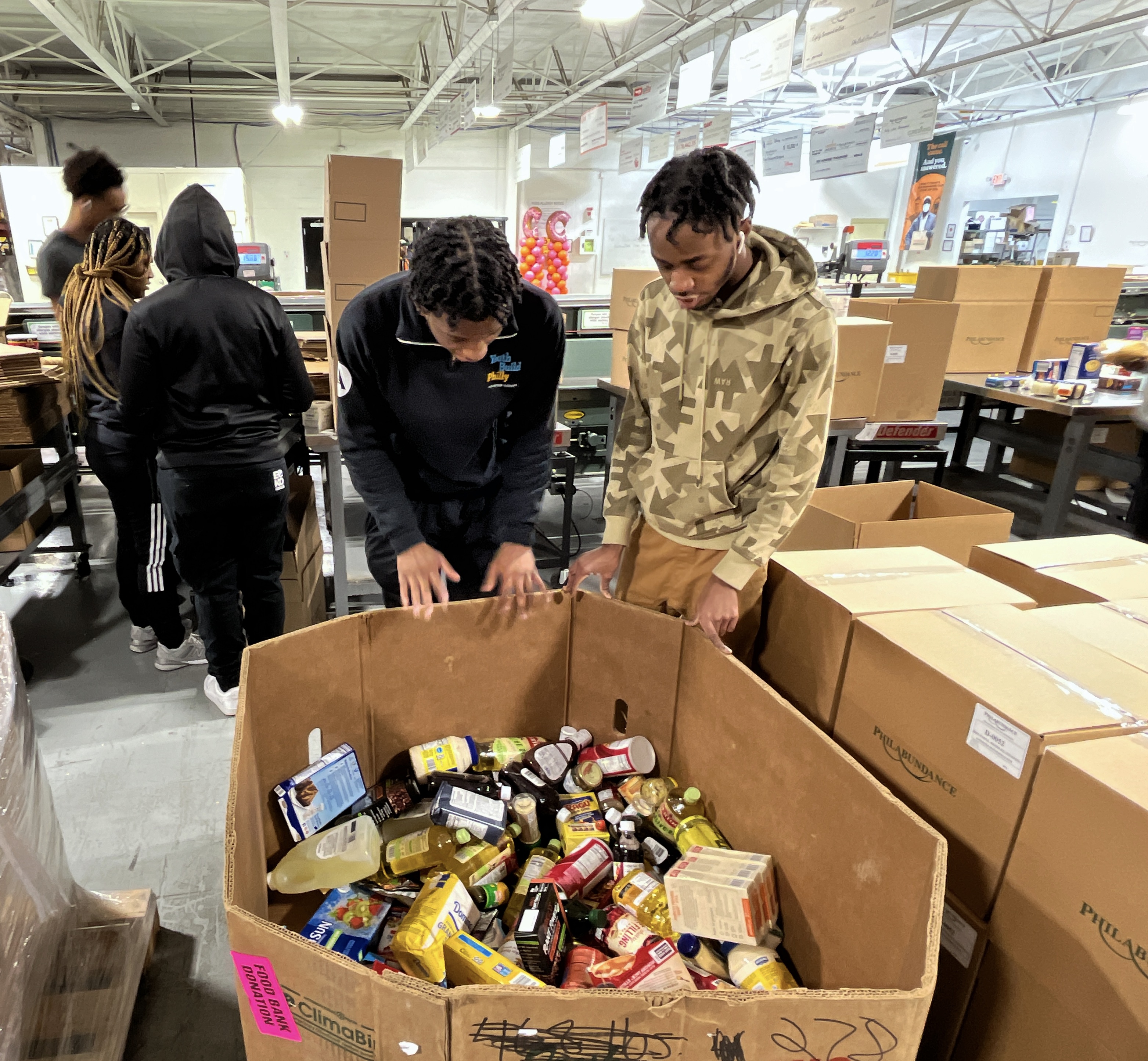Valentine’s Day Edition: YouthBuild Philly teams up with Philabundance to conduct service and prepare food boxes for families in need